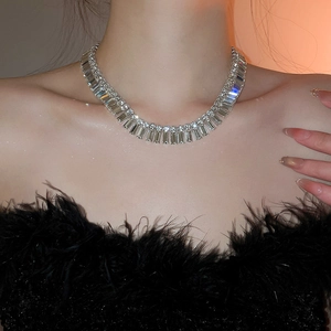 Close-up of luxury fringe necklace with sparkling rectangle and round rhinestones