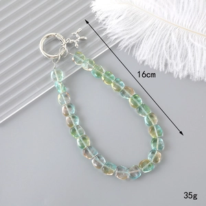 Detailed view of iridescent crystal heart phone strap with 16cm length and 35g weight