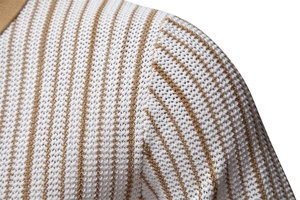 Detail of shoulder seam showing fine knit texture and white and camel stripes