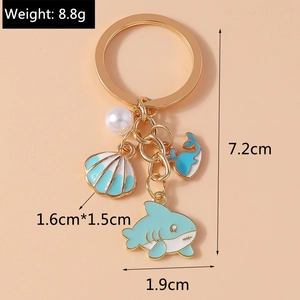 Detailed size specifications for ocean theme keychain with shark and shell charms