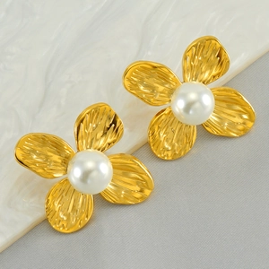 French style gold flower stud earrings with central pearl on textured petals