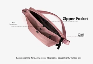 Internal structure of pink nylon crossbody bag with main compartment and zipper pockets