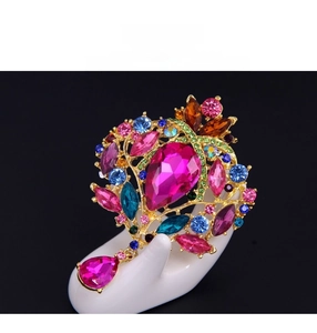 Detailed view of luxury vintage alloy brooch with colorful rhinestones and teardrop pendant