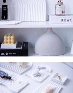 Macro shot of white wavy and arched plaster storage trays used for jewelry photography