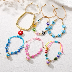 Bohemian handmade beaded Evil Eye bracelets with gold-plated accents and adjustable cords