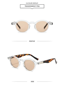 Detail view of vintage small frame sunglasses in transparent tea color with tortoiseshell legs