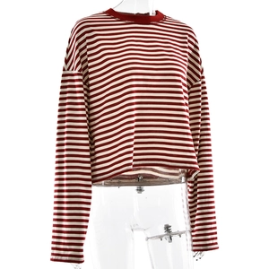 Detail shot of the cropped red and white striped long sleeve tee on a clear mannequin