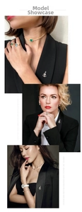 Close-up of nautical anchor brooch and matching jewelry set on a black blazer