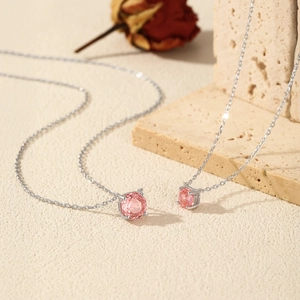 S925 sterling silver octagonal pink gemstone necklaces set on stone background