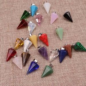Faceted natural stone pendulum necklaces in various colors on a rustic burlap background