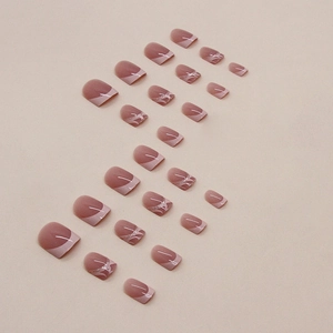 Short nude pink French nails with white tips and silver glitter accents on 24pcs set
