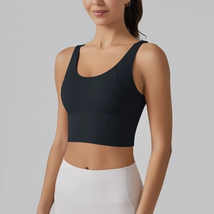 Detail of black V-back seamless sports bra with wide straps and matte texture fabric