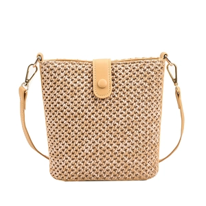 Beige bucket straw shoulder bag with adjustable leather strap and magnetic closure
