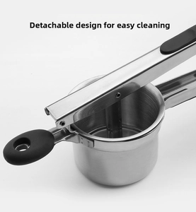 Detail showing the detachable cup and mesh filter of the stainless steel potato ricer