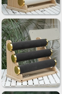 Three-tier bamboo jewelry display stand with black velvet rods and gold-tone metal caps