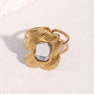 Detail of 18k gold plated stainless steel ring featuring rectangle zircon and textured band