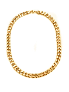 Close-up of classic golden stainless steel Cuban link necklace with polished finish
