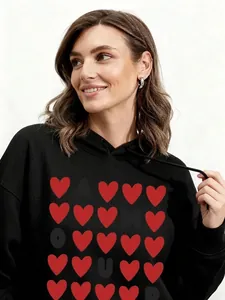 Thick black hoodie with heart print and adjustable drawstring in a comfortable fit