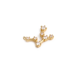 Macro shot of gold constellation pendant with clear zircon inlay and metal loop