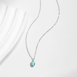 Elegant s925 silver necklace featuring an iridescent oval opal on a wavy metal chain