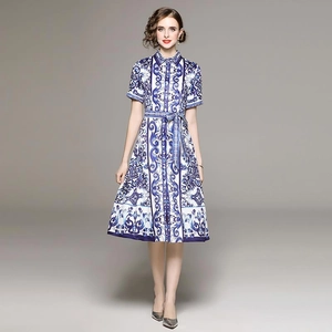 Elegant blue and white floral midi dress with short sleeves, lapel collar and matching belt