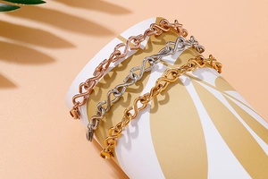 Polished infinity figure-8 link bracelets in gold, silver, and rose gold finishes