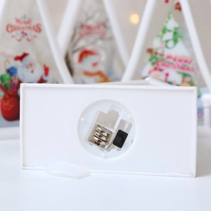 Detail view of the white base with battery compartment and power switch for LED lantern