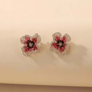 Exquisite handmade flower stud earrings with red beads and golden woven petal details