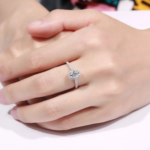 Close-up of a silver-tone ring featuring a large oval cubic zirconia in pavé setting