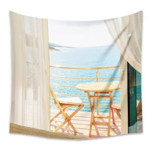 Detail of bohemian tapestry featuring a seaside balcony view with light curtains