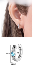 Detail view of silver hoop earrings with blue zircon inlays and precise dimensions