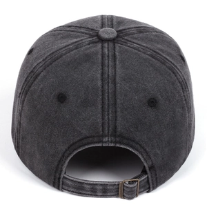 Detail of adjustable metal buckle and washed cotton texture on dark grey baseball cap
