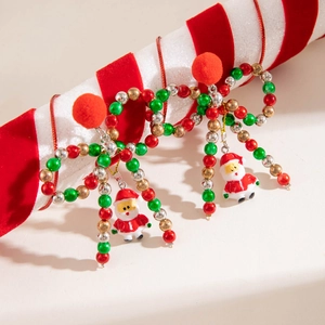 Fashionable Christmas bow earrings with colorful beads and Santa Claus charms on ribbon