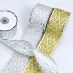 Close-up of metallic wired gold and silver ribbons with sparkling diamond pattern texture