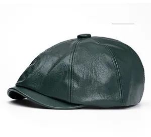 Detailed view of dark green PU leather newsboy cap showing fine texture and stitching