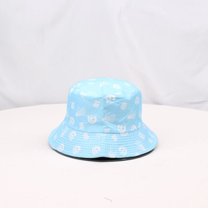 Detailed view of the sky blue bucket hat featuring white skull and BOO prints