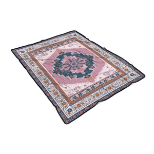 Detail of bohemian patterned flannel blanket showing ethnic geometric prints and soft texture