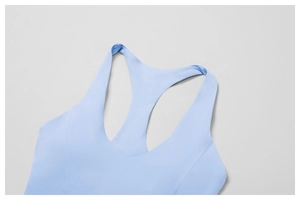 Close-up of racerback yoga vest showing reinforced seams and high-elasticity fabric