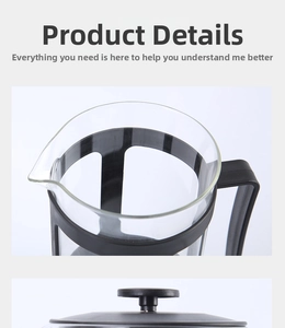Detail view of French press glass carafe with a black frame and heat-resistant handle