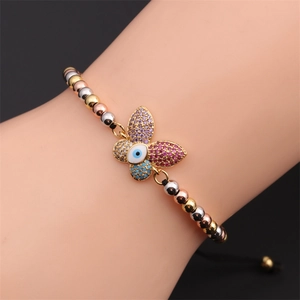 Detail of butterfly evil eye bracelet with colorful zircons on adjustable black cord