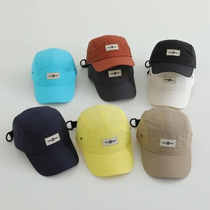 Detail showing various colors of lightweight five-panel camping caps with breathable vents