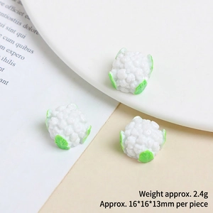 Macro view of miniature resin cauliflower charms for DIY crafts with size and weight detail