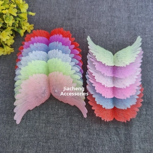 Macro shot of colorful plastic angel wings accessories for Christmas craft and cake decor