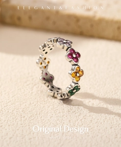 Macro view of S925 sterling silver ring with colorful zirconia four-leaf clover flowers