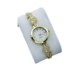 Elegant gold quartz watch for women with rhinestone heart bracelet on display pillow
