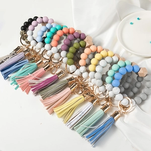 Silicone beaded bracelet keychain with leather tassel and wood bead in various colors
