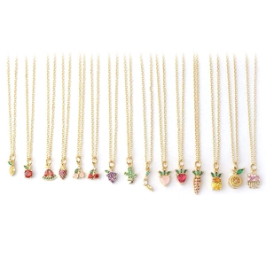 Golden necklace collection featuring zircon fruit pendants like cherry, strawberry, and grape