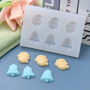 Christmas silicone mold featuring 6 cavities with Santa Claus and bell designs for DIY baking