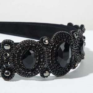 Macro detail of baroque black rhinestone headband with intricate beaded craftsmanship