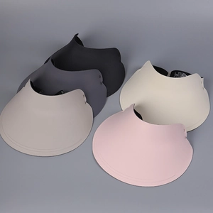 Detail showing five colors of wide brim sun visors including black, grey, beige and pink